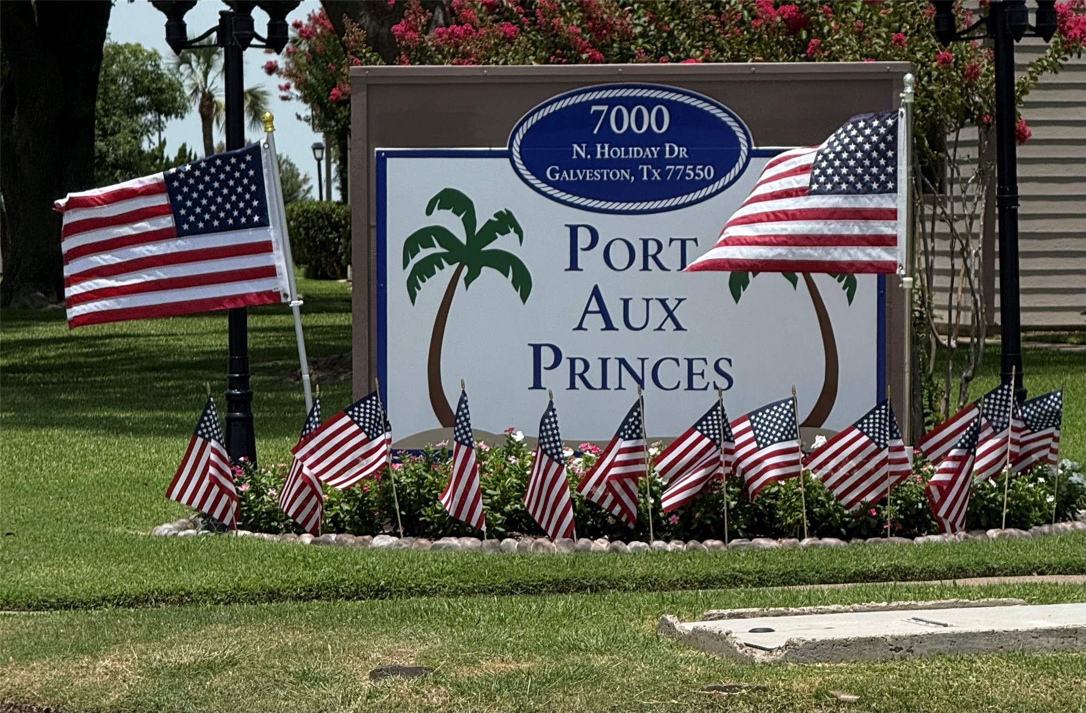 a front view of a house and a garden