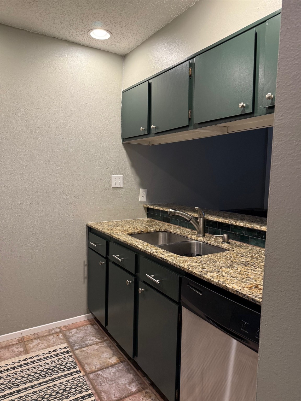 7112 North Holiday Drive, Unit 7112 Galveston, TX 77550 - Photo 11 of 19 a bathroom with a sink and a mirror
