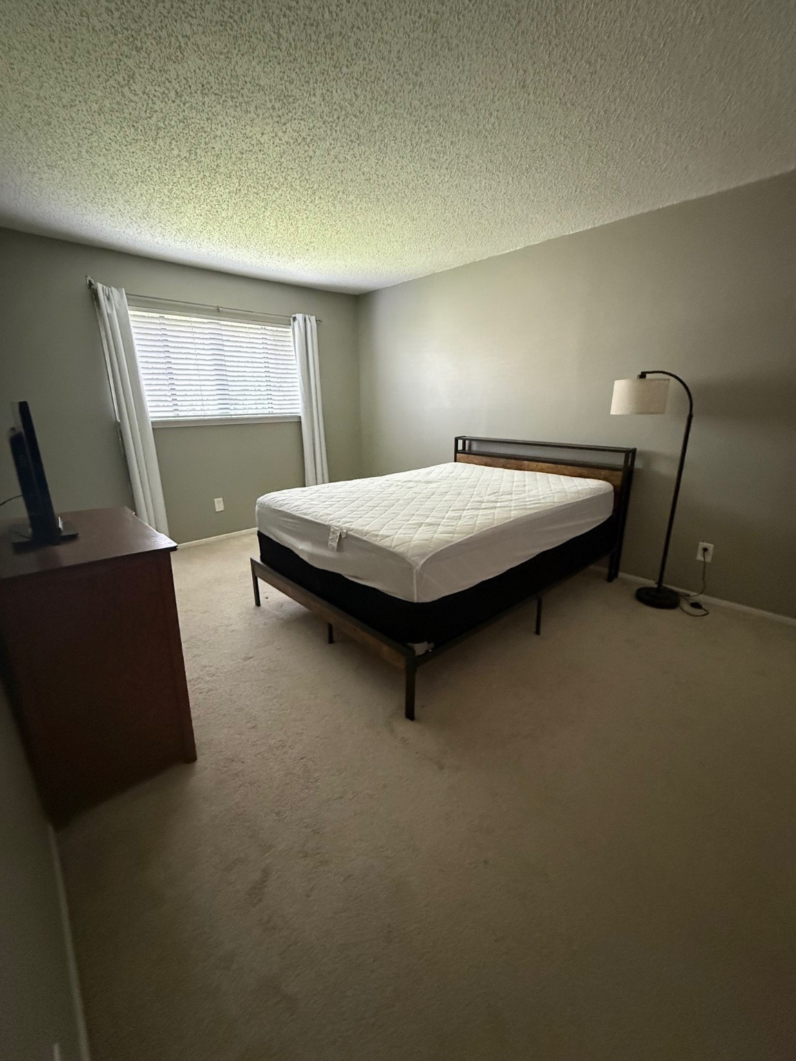 7112 North Holiday Drive, Unit 7112 Galveston, TX 77550 - Photo 15 of 19 a bedroom with a bed and window