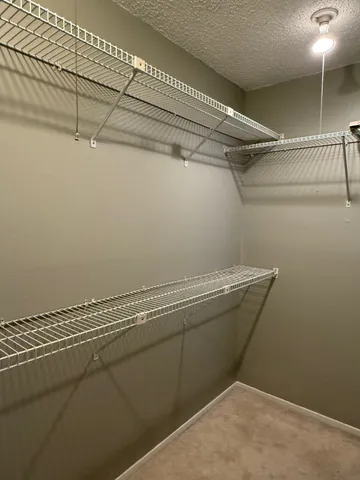 a view of a room with racks on the wall