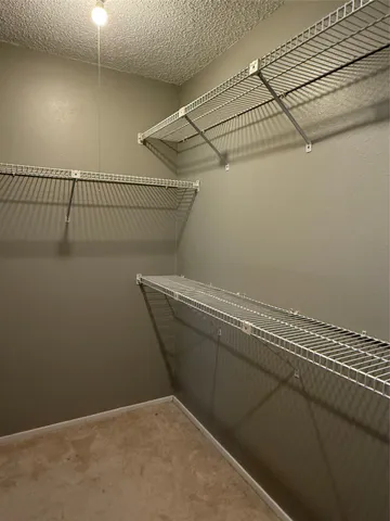 a view of a room with racks on the wall