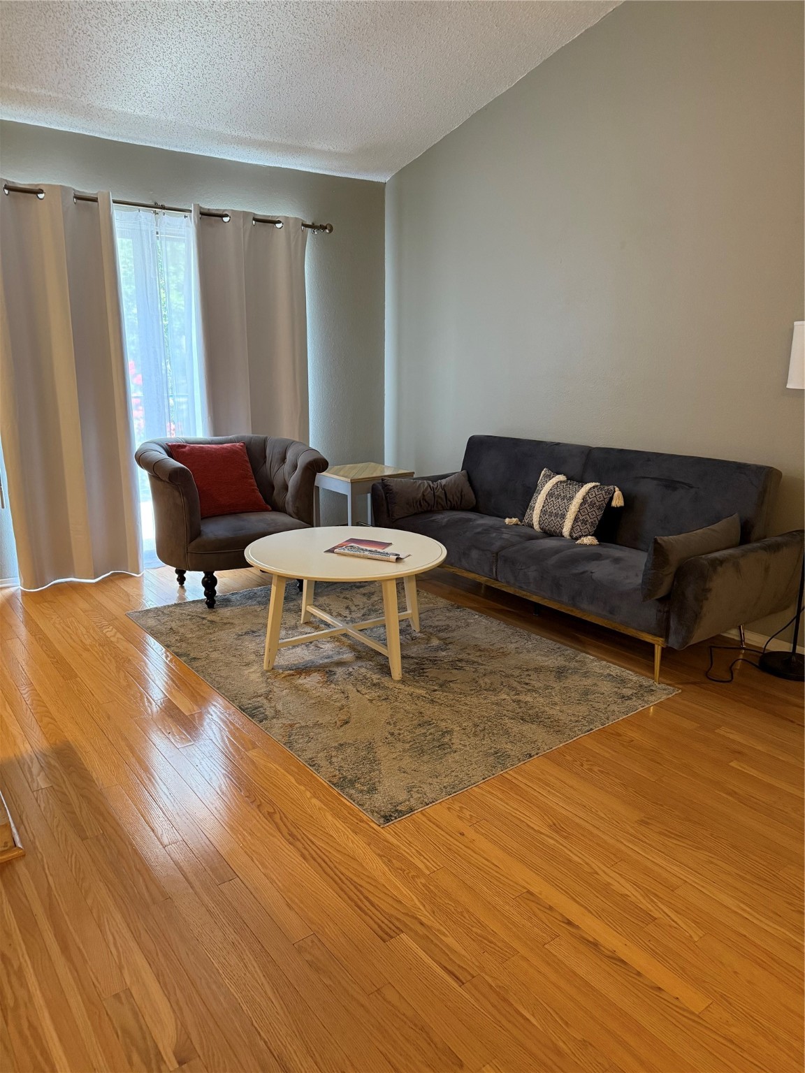 7112 North Holiday Drive, Unit 7112 Galveston, TX 77550 - Photo 5 of 19 a living room with furniture and a large window