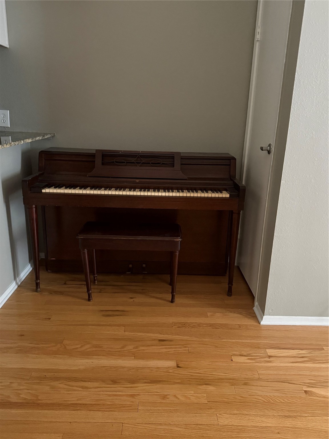 7112 North Holiday Drive, Unit 7112 Galveston, TX 77550 - Photo 7 of 19 a living room with a piano and a table