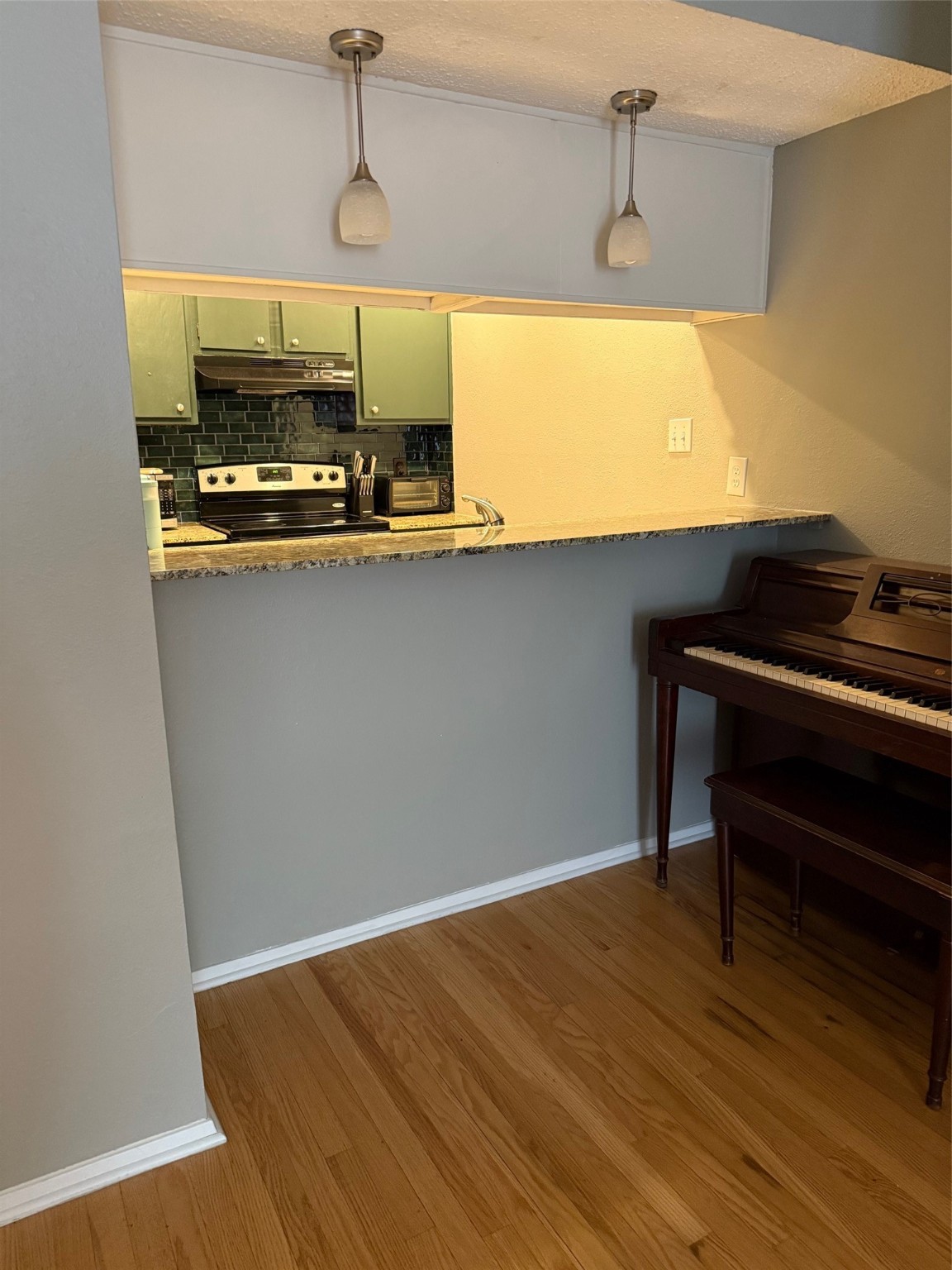 7112 North Holiday Drive, Unit 7112 Galveston, TX 77550 - Photo 9 of 19 a kitchen with a sink and wooden floor