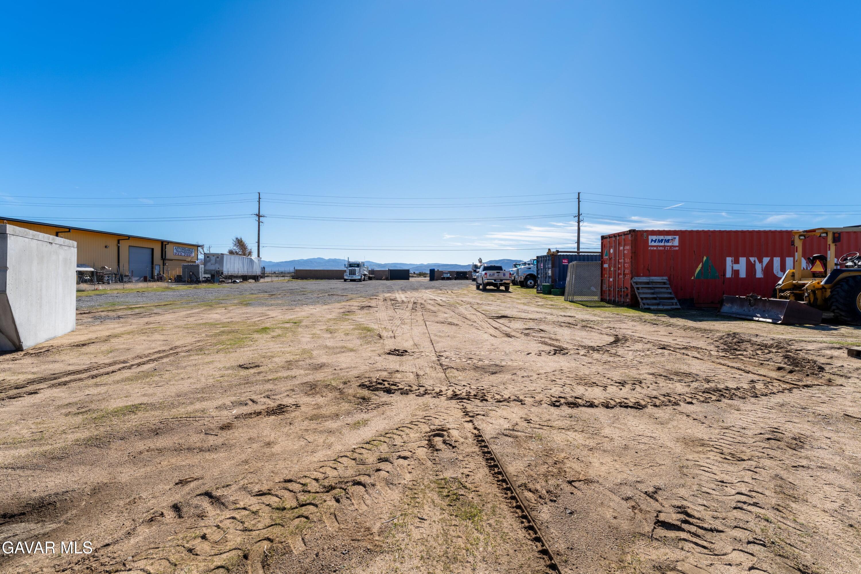 Columbia Way East Lancaster, CA 93535 - Photo 9 of 12 a view of a dirt road and a building