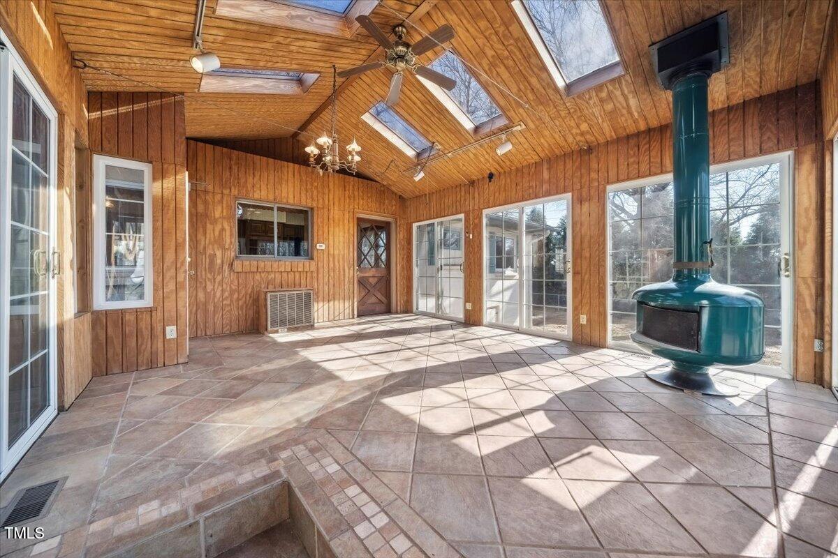 1234 Duffy Place Raleigh, NC 27603 - Photo 24 of 26 Large closed in porch with fire place