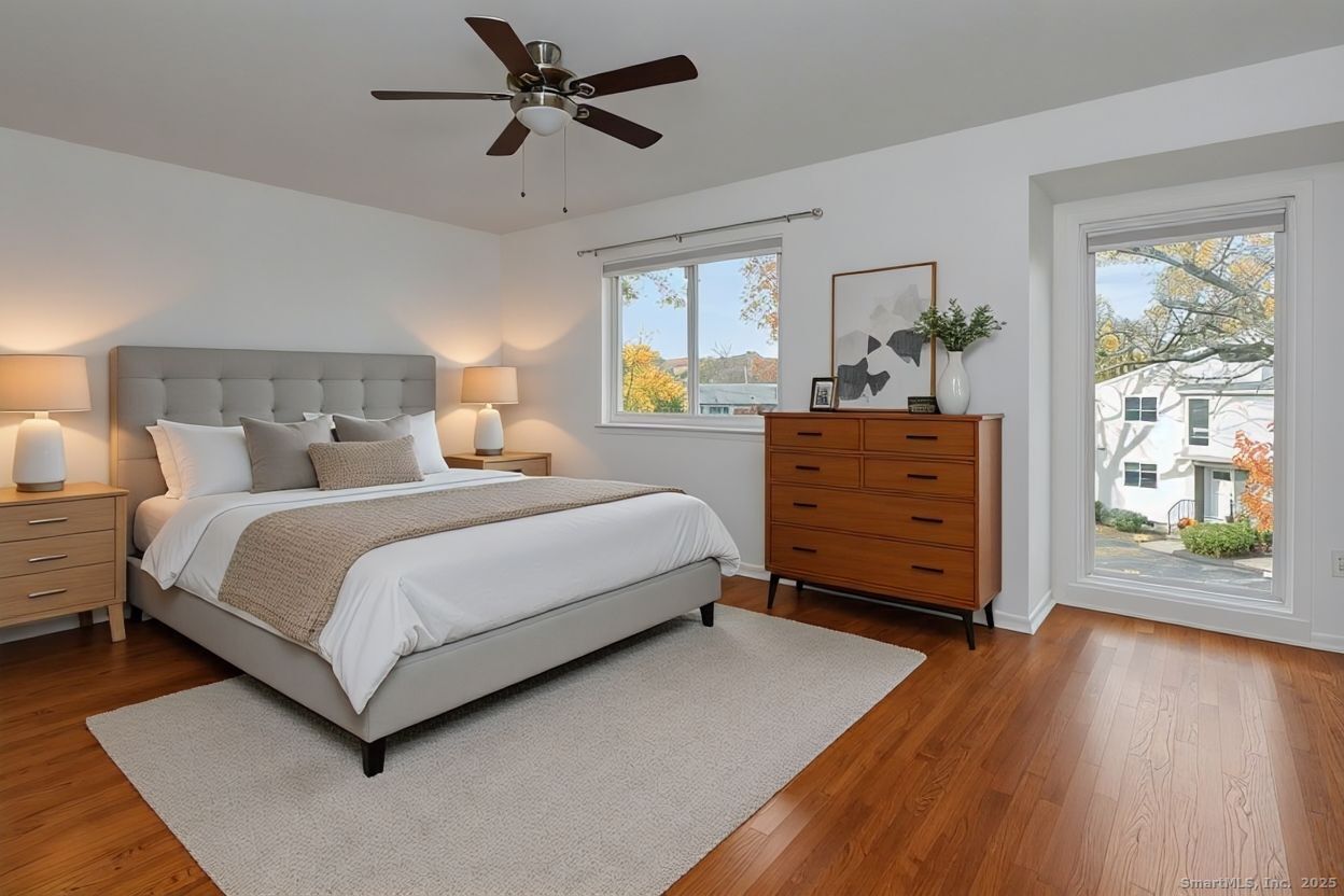 52 Randall Avenue, Unit 8 Stamford, CT 06905 - Photo 11 of 24 a bedroom with a bed and window