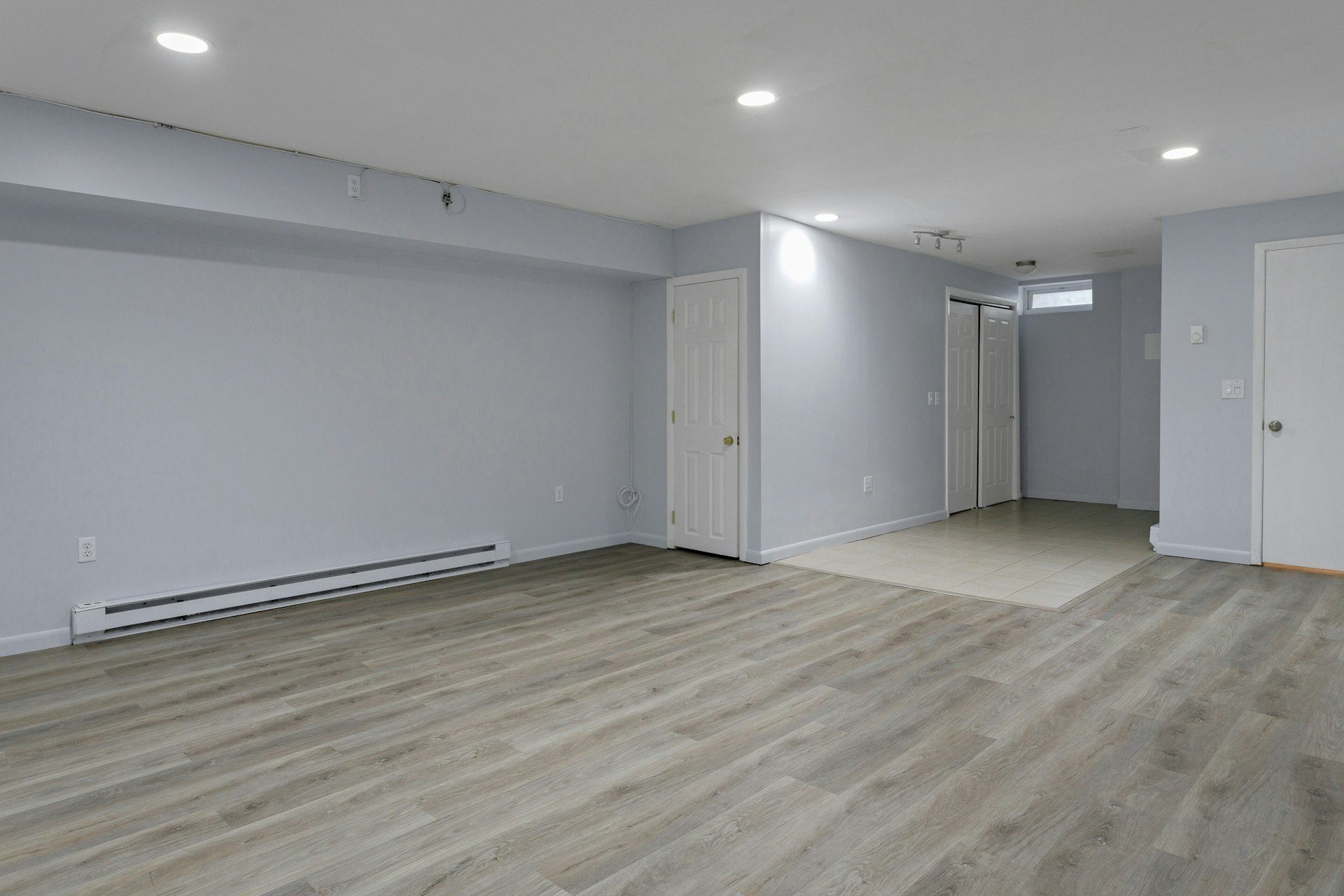 52 Randall Avenue, Unit 8 Stamford, CT 06905 - Photo 15 of 24 a view of an empty room with wooden floor