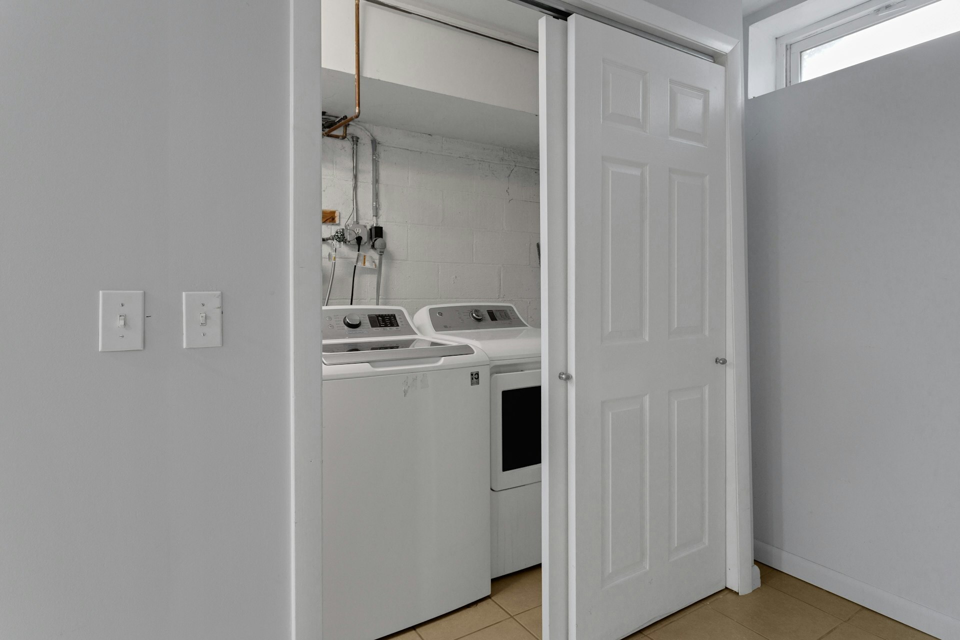52 Randall Avenue, Unit 8 Stamford, CT 06905 - Photo 17 of 24 a utility room with dryer and washer