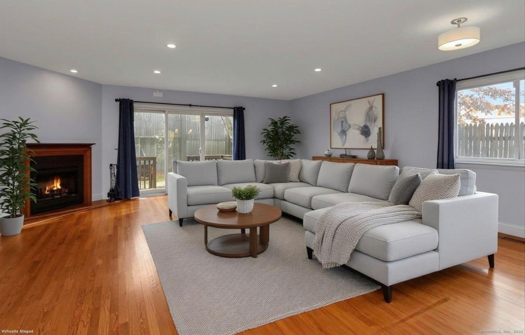 52 Randall Avenue, Unit 8 Stamford, CT 06905 - Photo 6 of 24 a living room with furniture and a fireplace