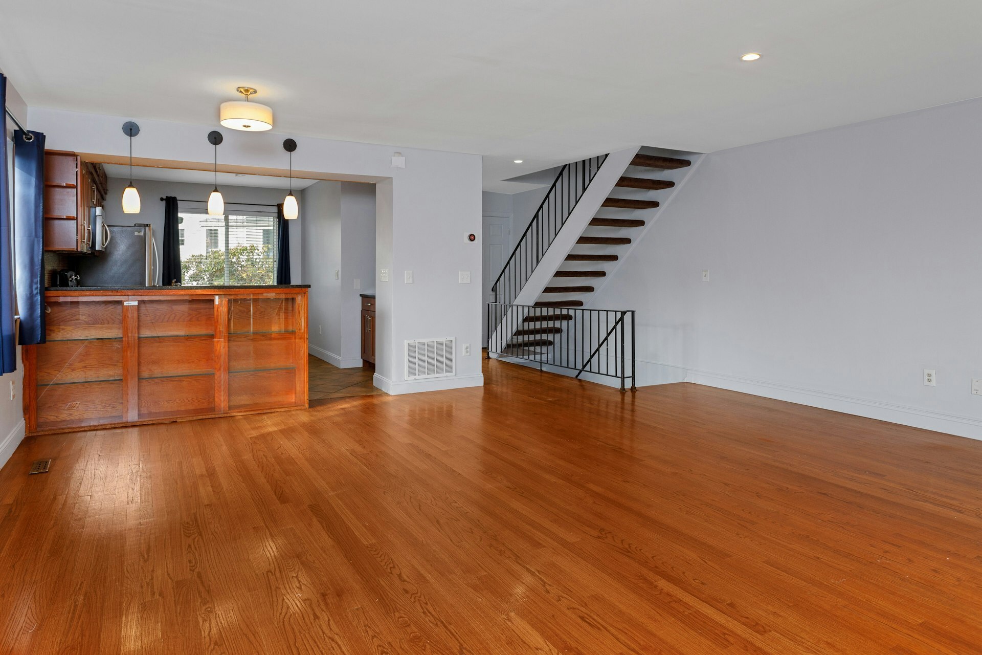 52 Randall Avenue, Unit 8 Stamford, CT 06905 - Photo 7 of 24 a view of empty room with wooden floor and fan