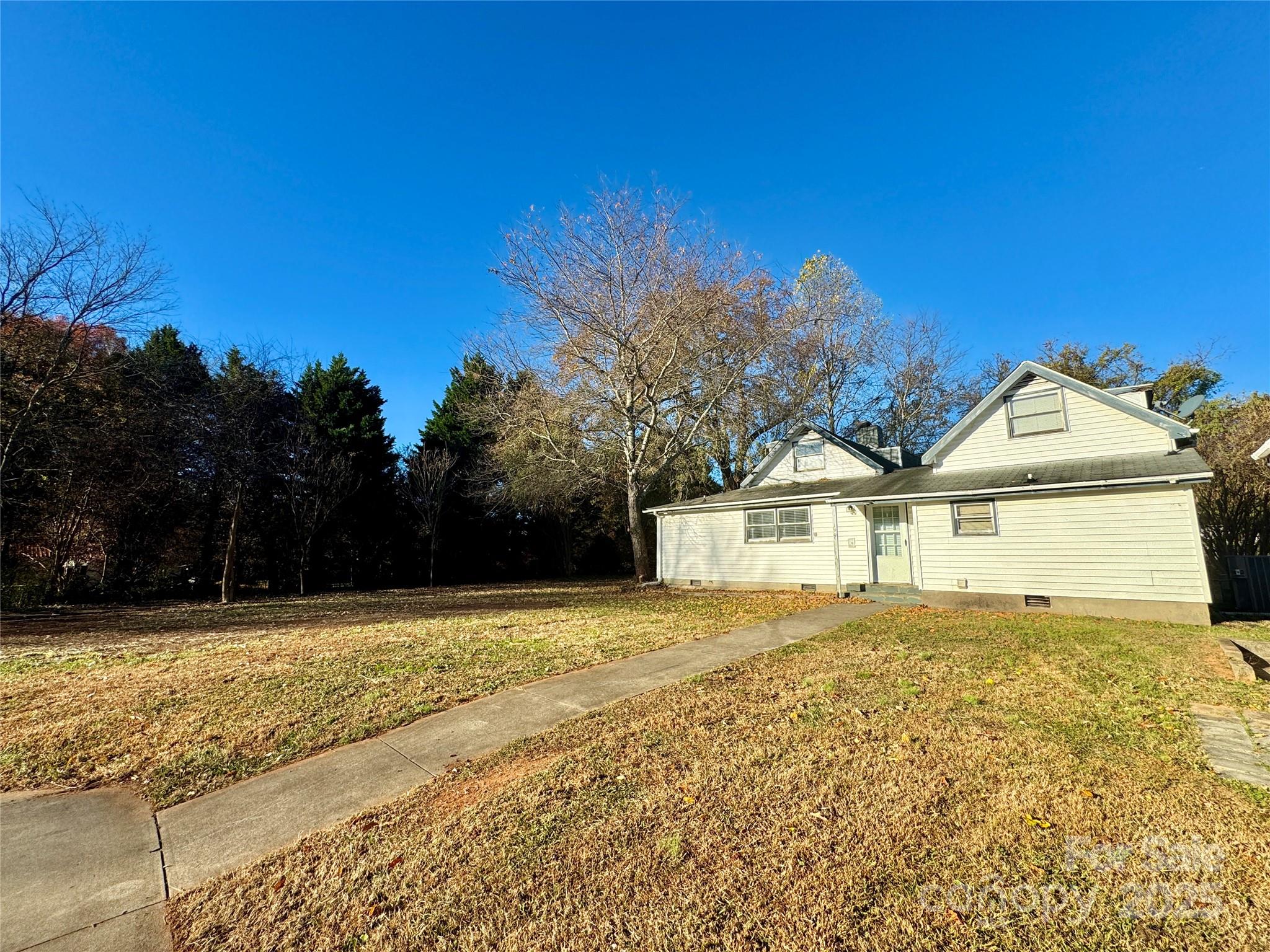 199 Bell Farm Road Statesville, NC 28625 - Photo 11 of 48 a view of a house with a yard
