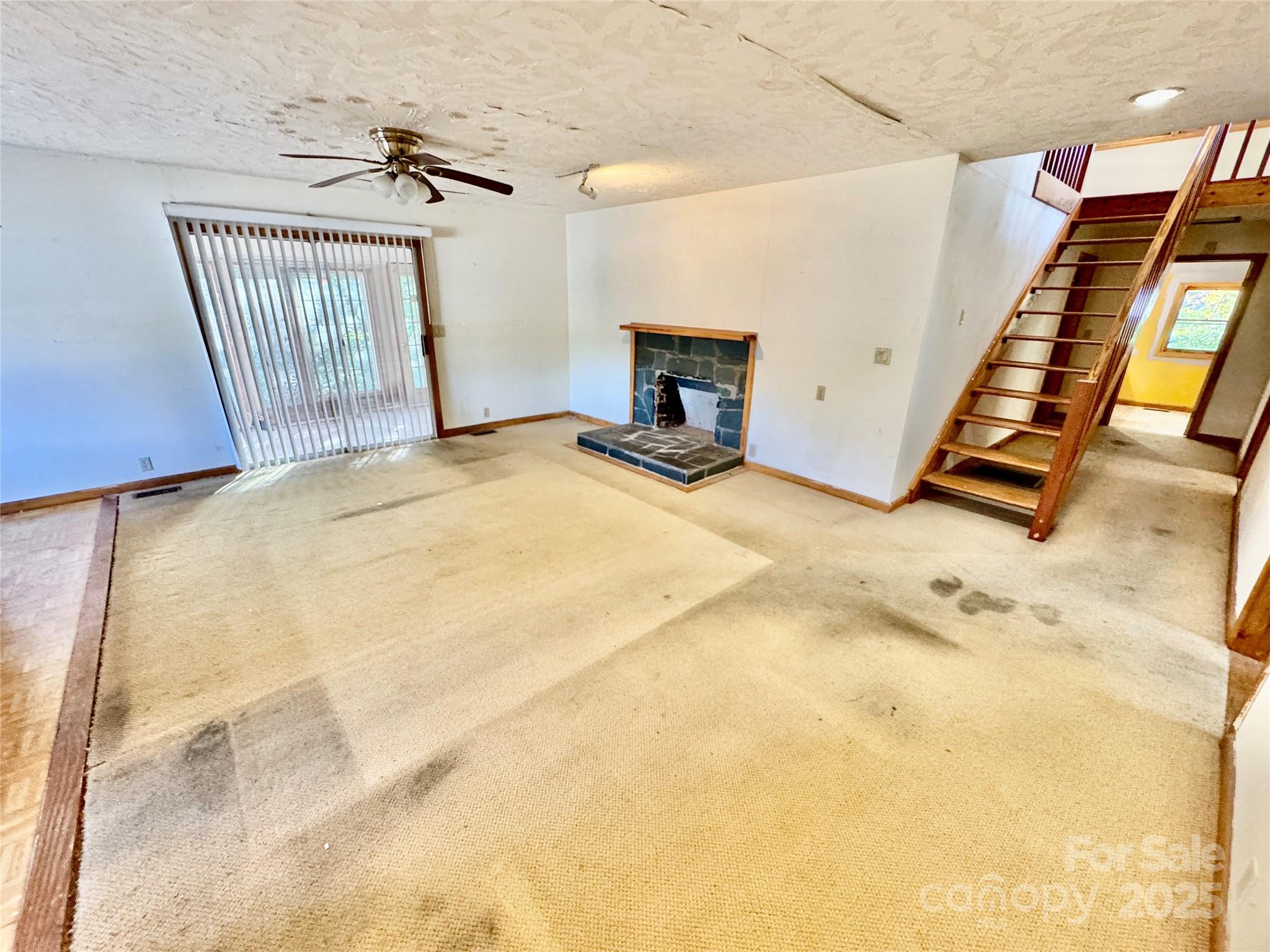 199 Bell Farm Road Statesville, NC 28625 - Photo 19 of 48 a view of a livingroom with furniture and a fireplace