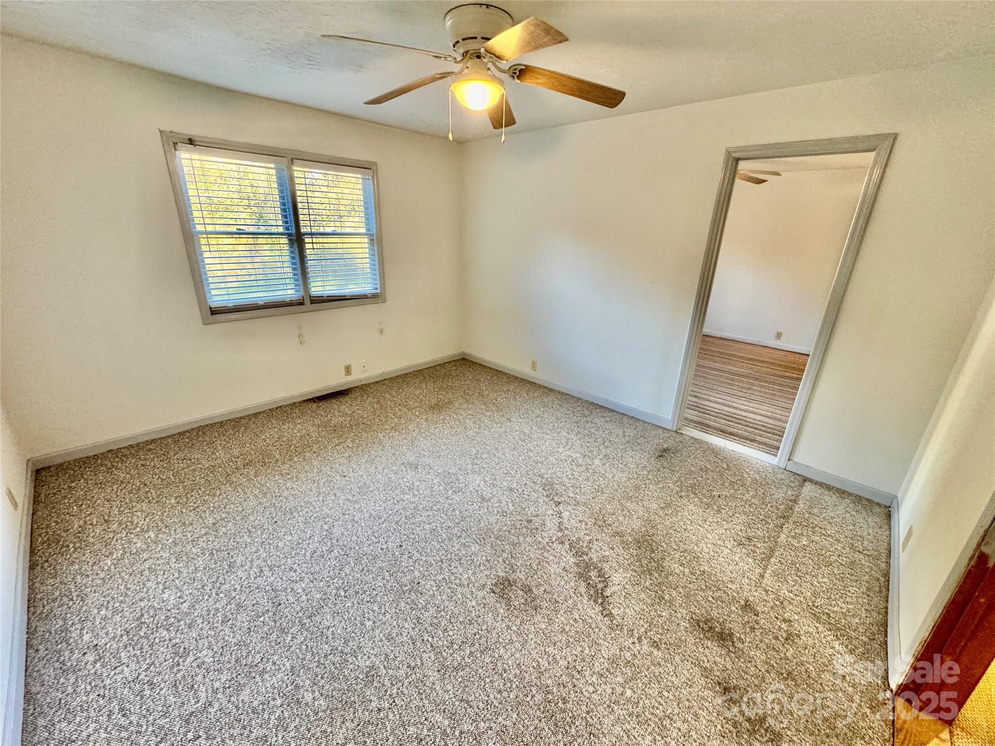 199 Bell Farm Road Statesville, NC 28625 - Photo 20 of 48 an empty room with windows and closet
