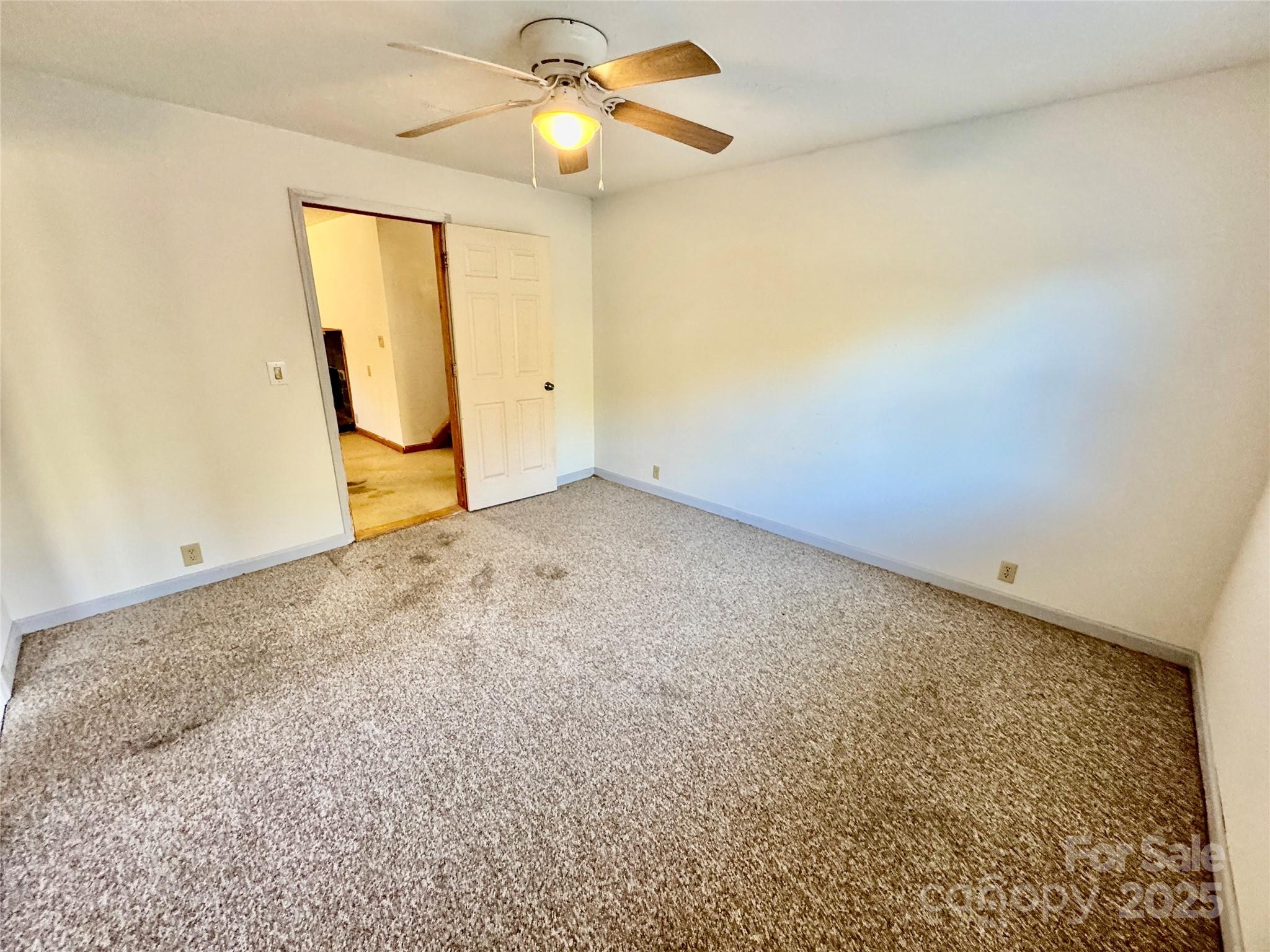 199 Bell Farm Road Statesville, NC 28625 - Photo 21 of 48 an empty room with windows and fan