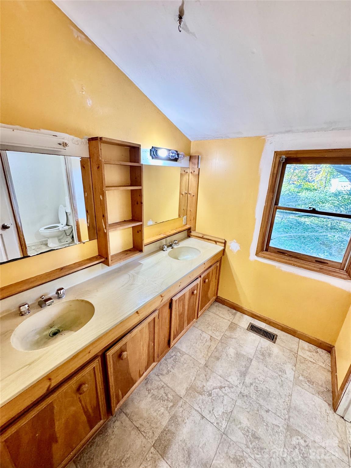 199 Bell Farm Road Statesville, NC 28625 - Photo 27 of 48 a bathroom with a granite countertop sink and a mirror
