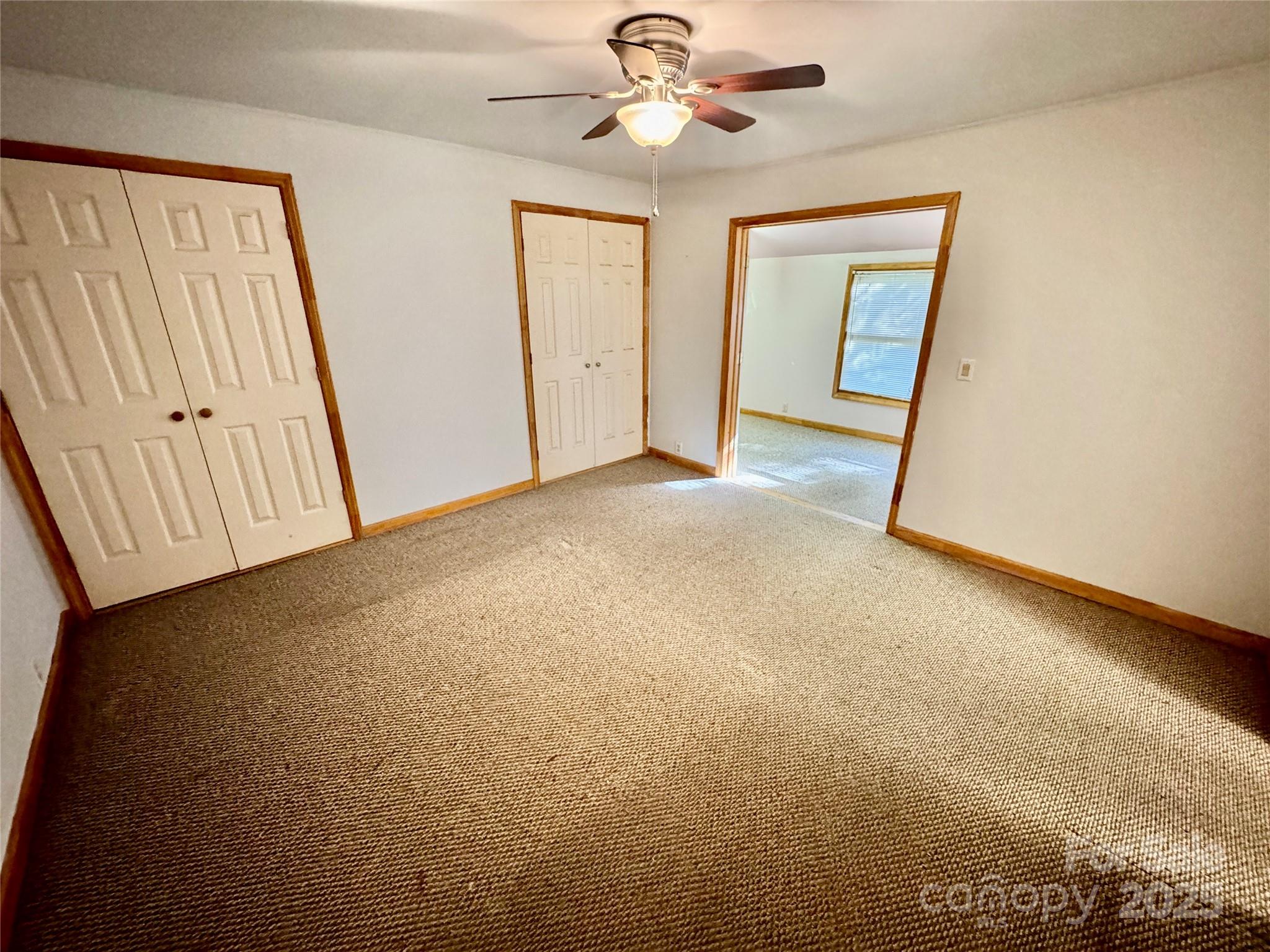 199 Bell Farm Road Statesville, NC 28625 - Photo 29 of 48 an empty room with windows and fan