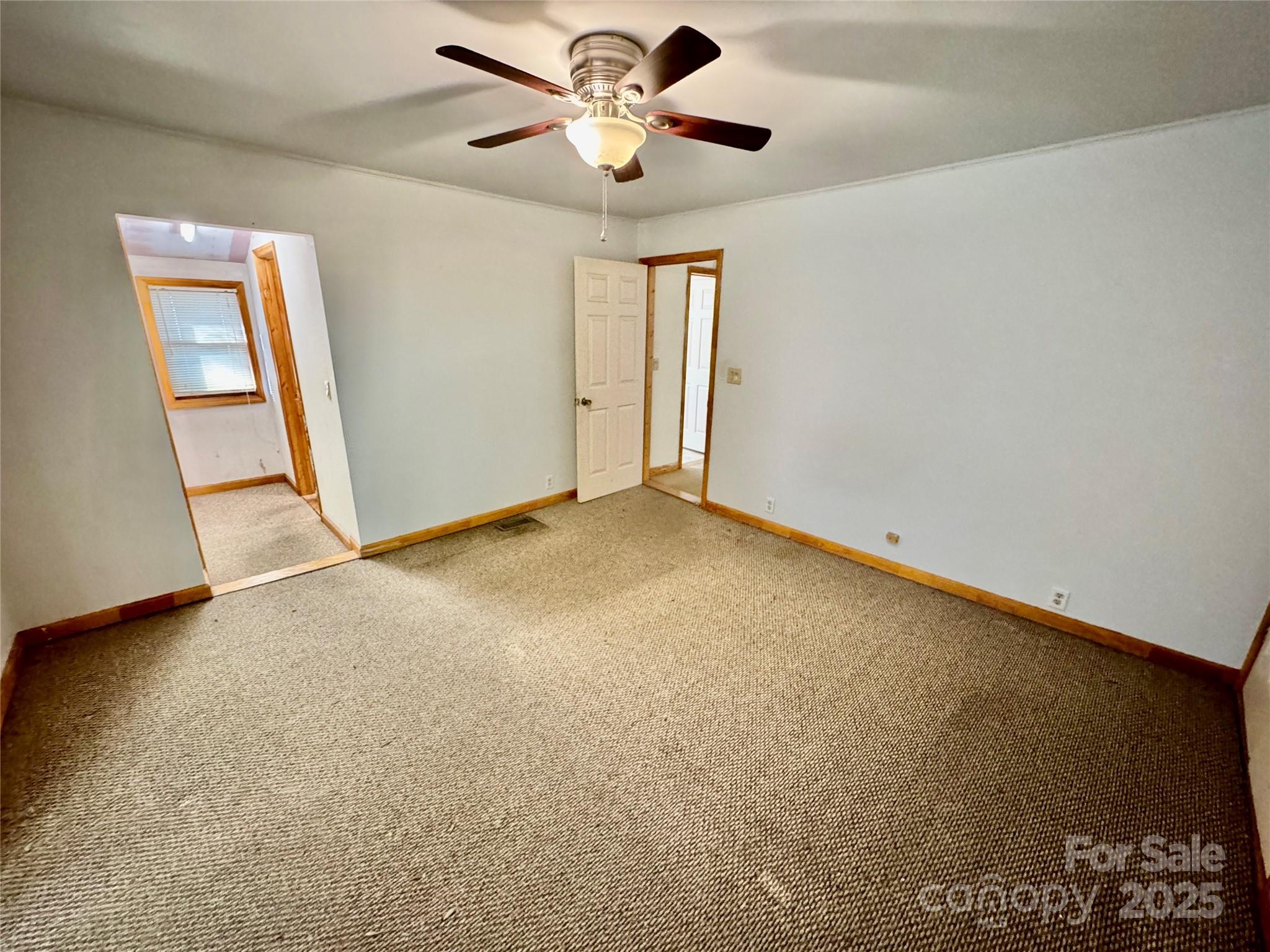 199 Bell Farm Road Statesville, NC 28625 - Photo 30 of 48 a view of an empty room and a ceiling fan