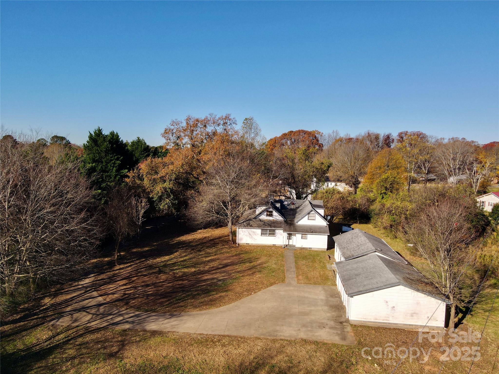 199 Bell Farm Road Statesville, NC 28625 - Photo 3 of 48 a view of a swimming pool with a yard