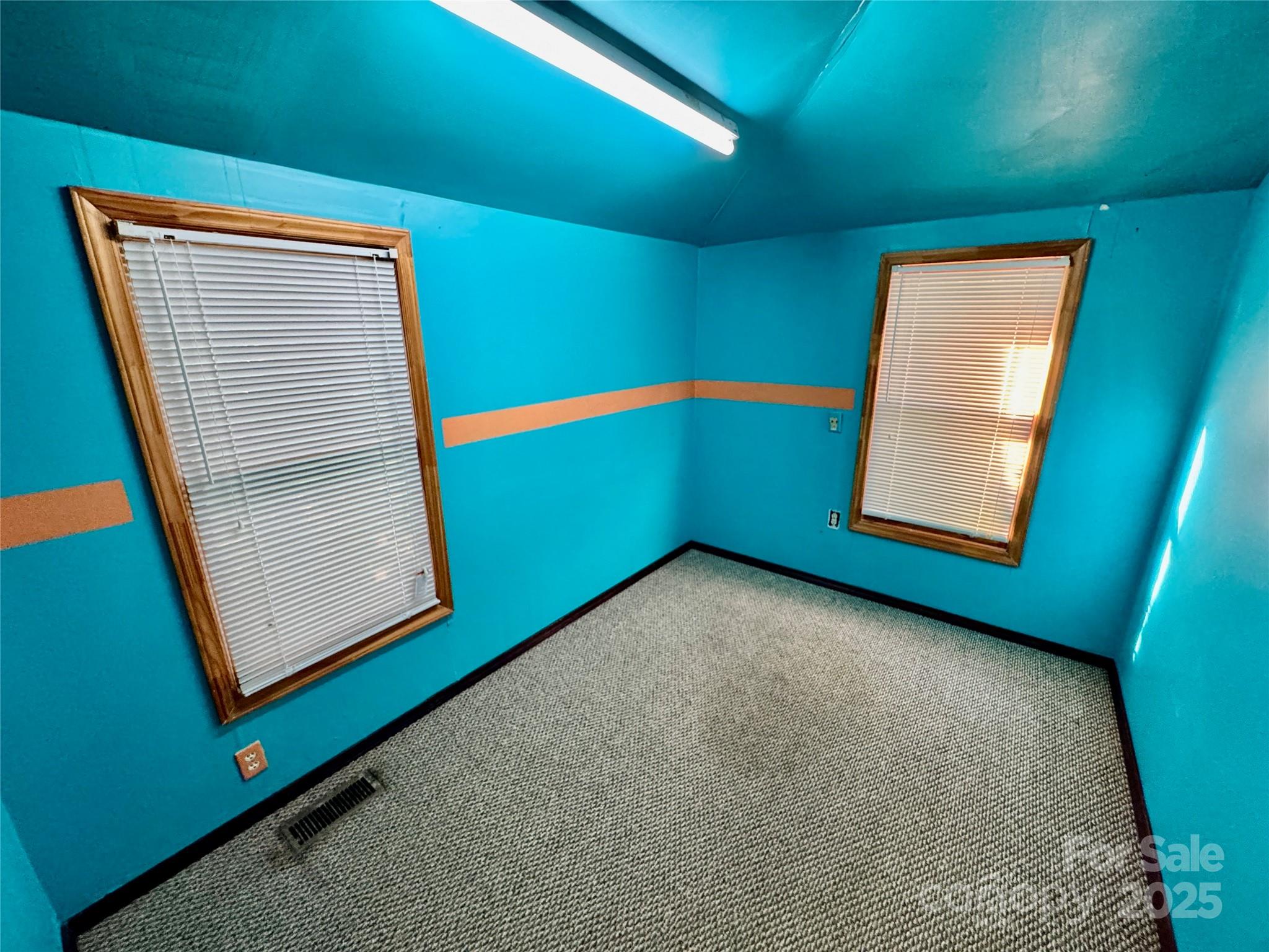 199 Bell Farm Road Statesville, NC 28625 - Photo 31 of 48 a view of an empty room with window and stairs