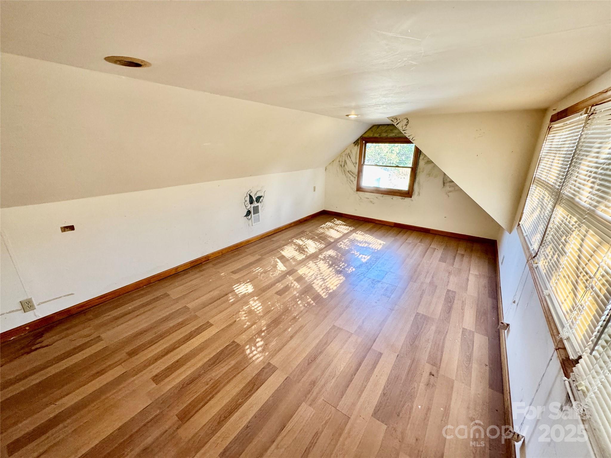 199 Bell Farm Road Statesville, NC 28625 - Photo 37 of 48 a view of empty room with wooden floor and fan