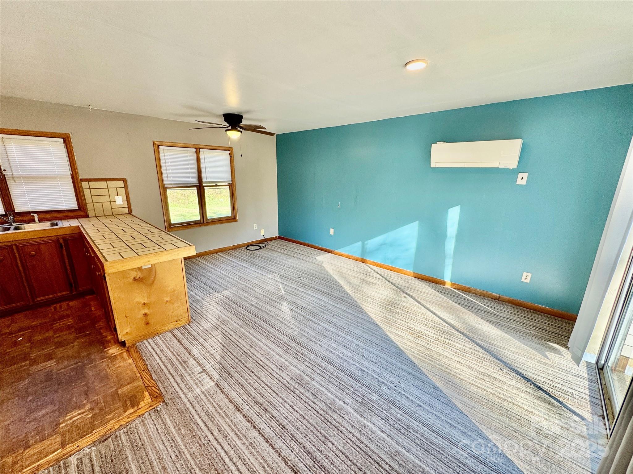 199 Bell Farm Road Statesville, NC 28625 - Photo 42 of 48 a view of a livingroom with wooden floor and workspace