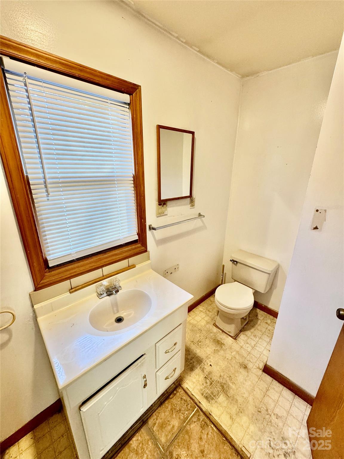 199 Bell Farm Road Statesville, NC 28625 - Photo 47 of 48 a bathroom with a sink mirror vanity and toilet
