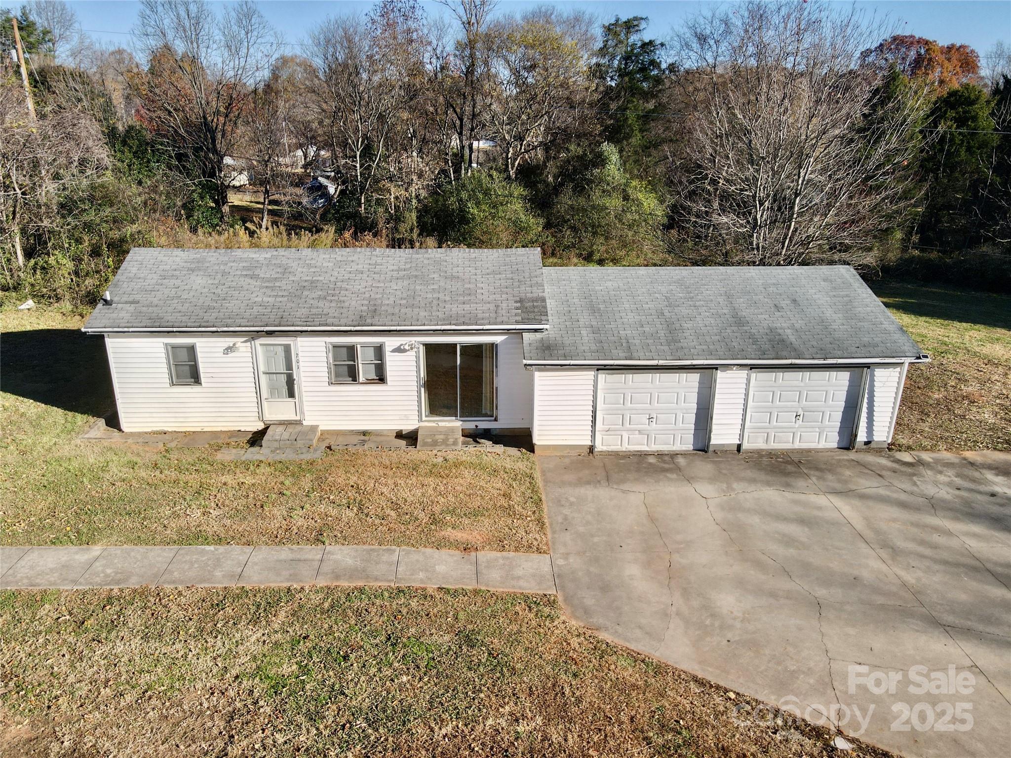 199 Bell Farm Road Statesville, NC 28625 - Photo 10 of 48 a view of a house with a yard and large tree