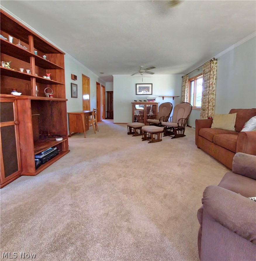 39195 Johnnycake Ridge Road Willoughby, OH 44094 - Photo 9 of 22 Carpeted living room featuring ceiling fan