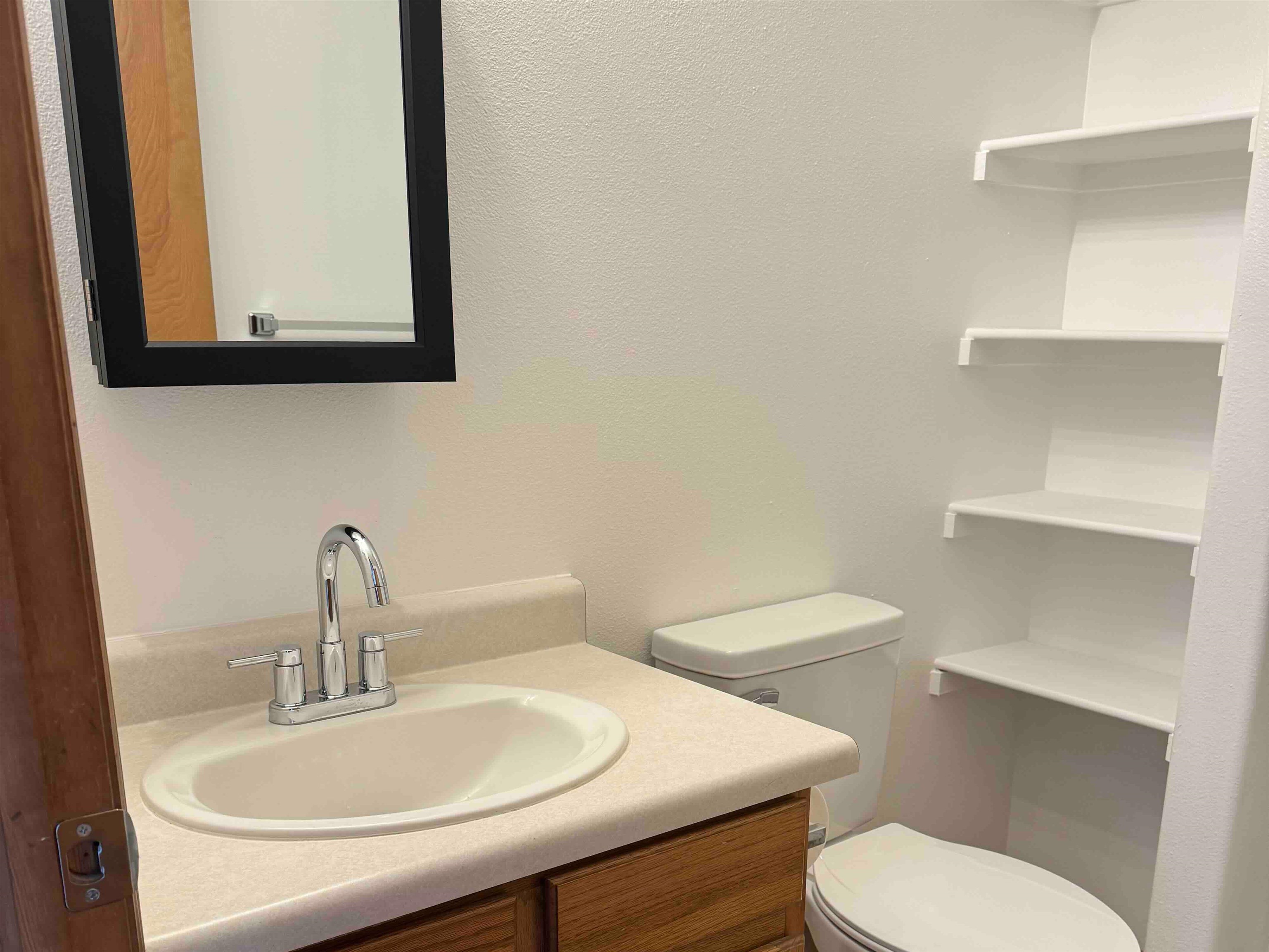 419 1/2 29 1/2 Road Grand Junction, CO 81504 - Photo 13 of 36 a bathroom with a toilet a sink and mirror