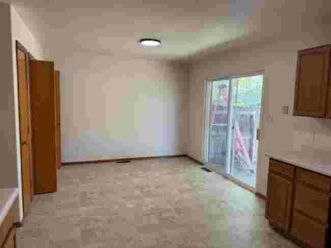 419 1/2 29 1/2 Road Grand Junction, CO 81504 - Photo 17 of 36 a view of an empty room with a fireplace and a window