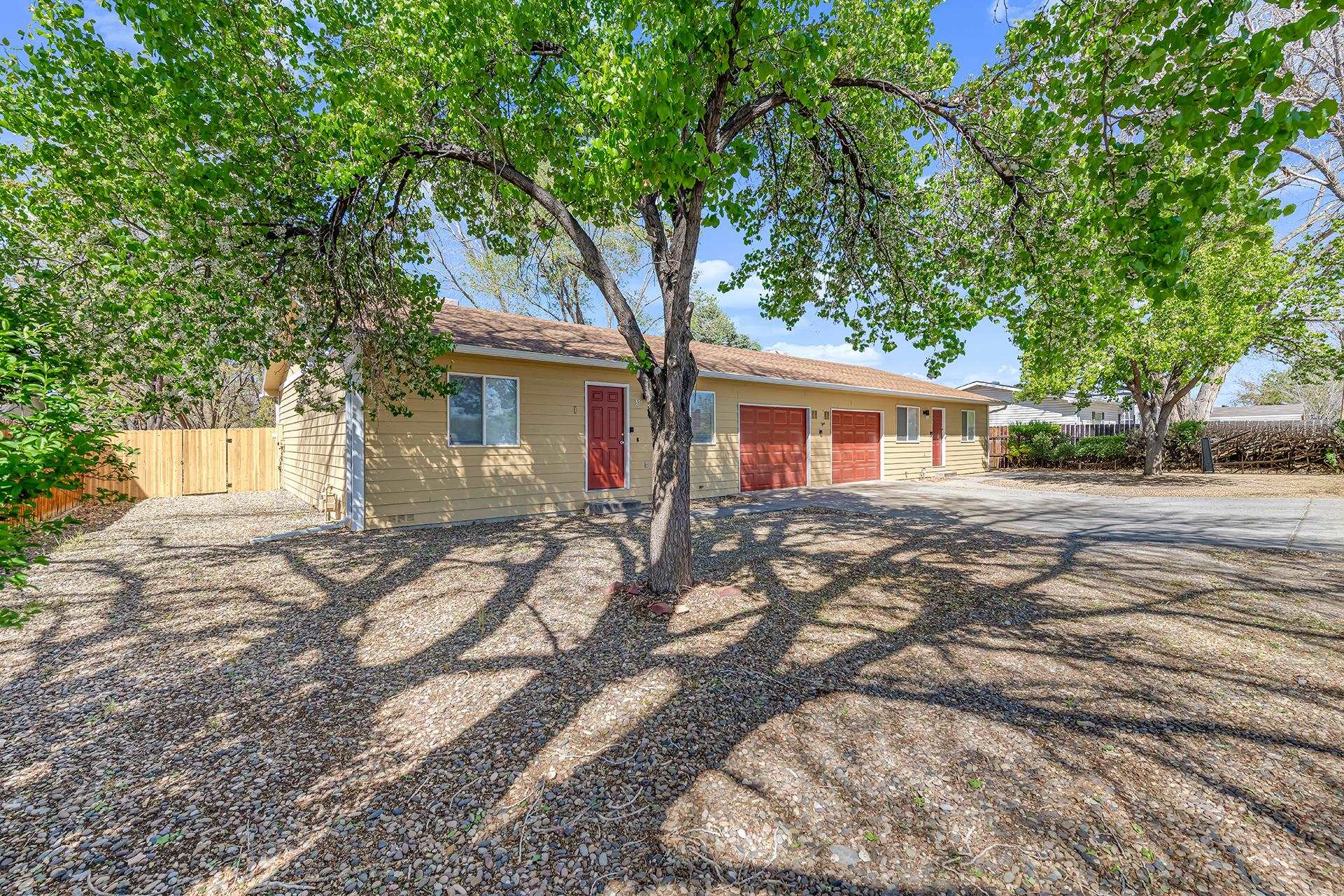 419 1/2 29 1/2 Road Grand Junction, CO 81504 - Photo 2 of 36 a front view of a house with a yard