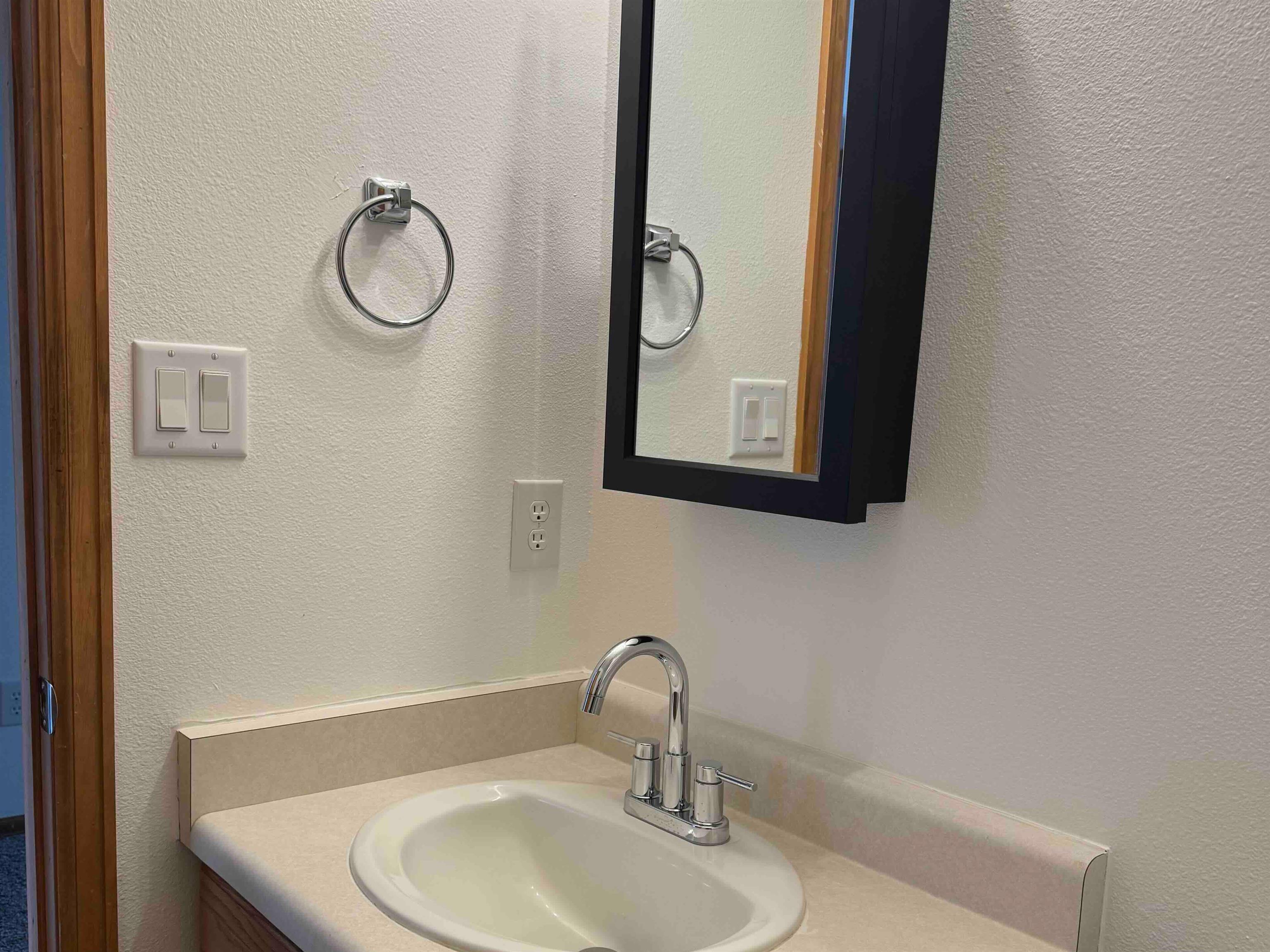 419 1/2 29 1/2 Road Grand Junction, CO 81504 - Photo 25 of 36 a bathroom with a sink and a mirror