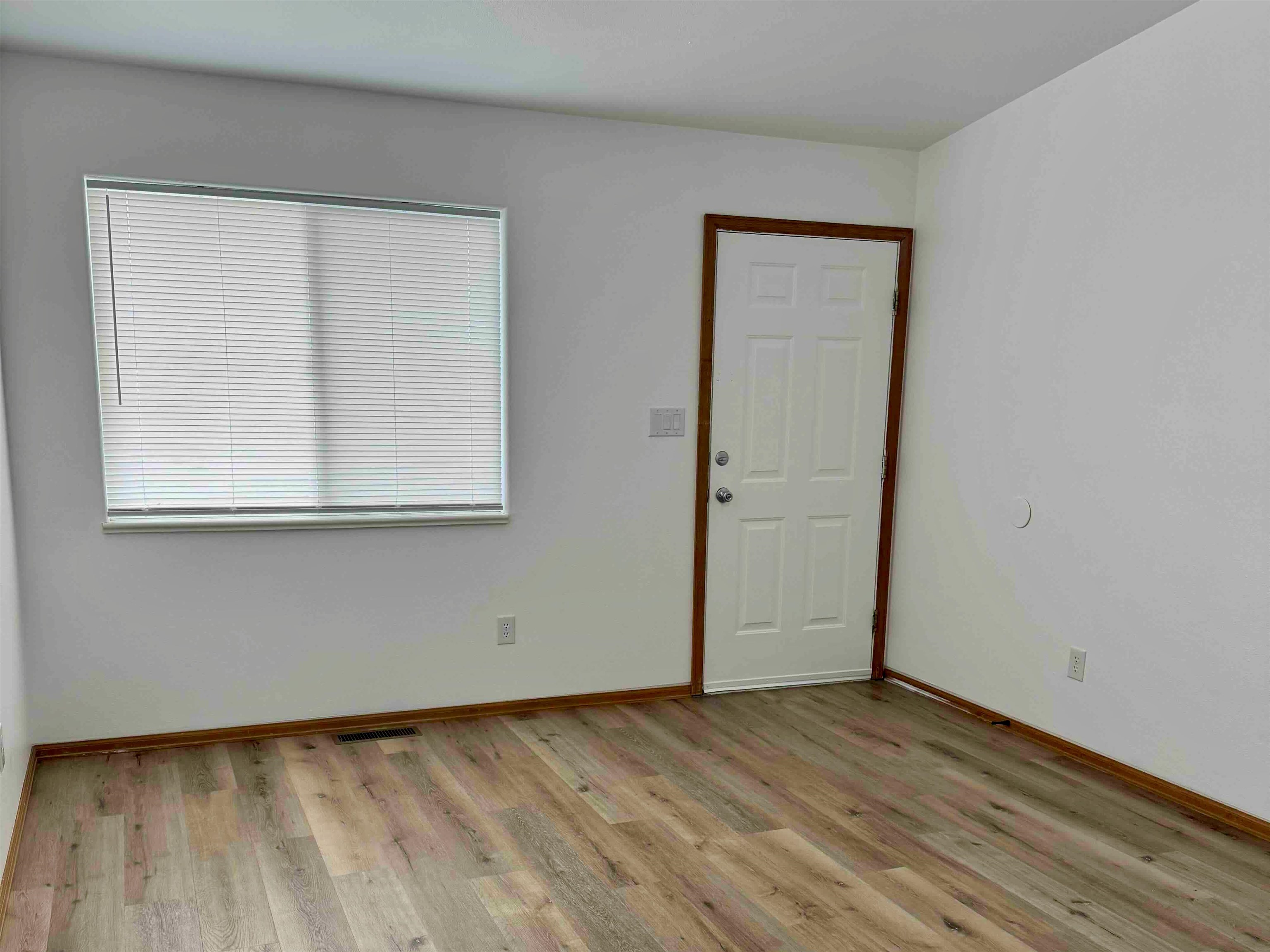 419 1/2 29 1/2 Road Grand Junction, CO 81504 - Photo 3 of 36 an empty room with wooden floor and windows