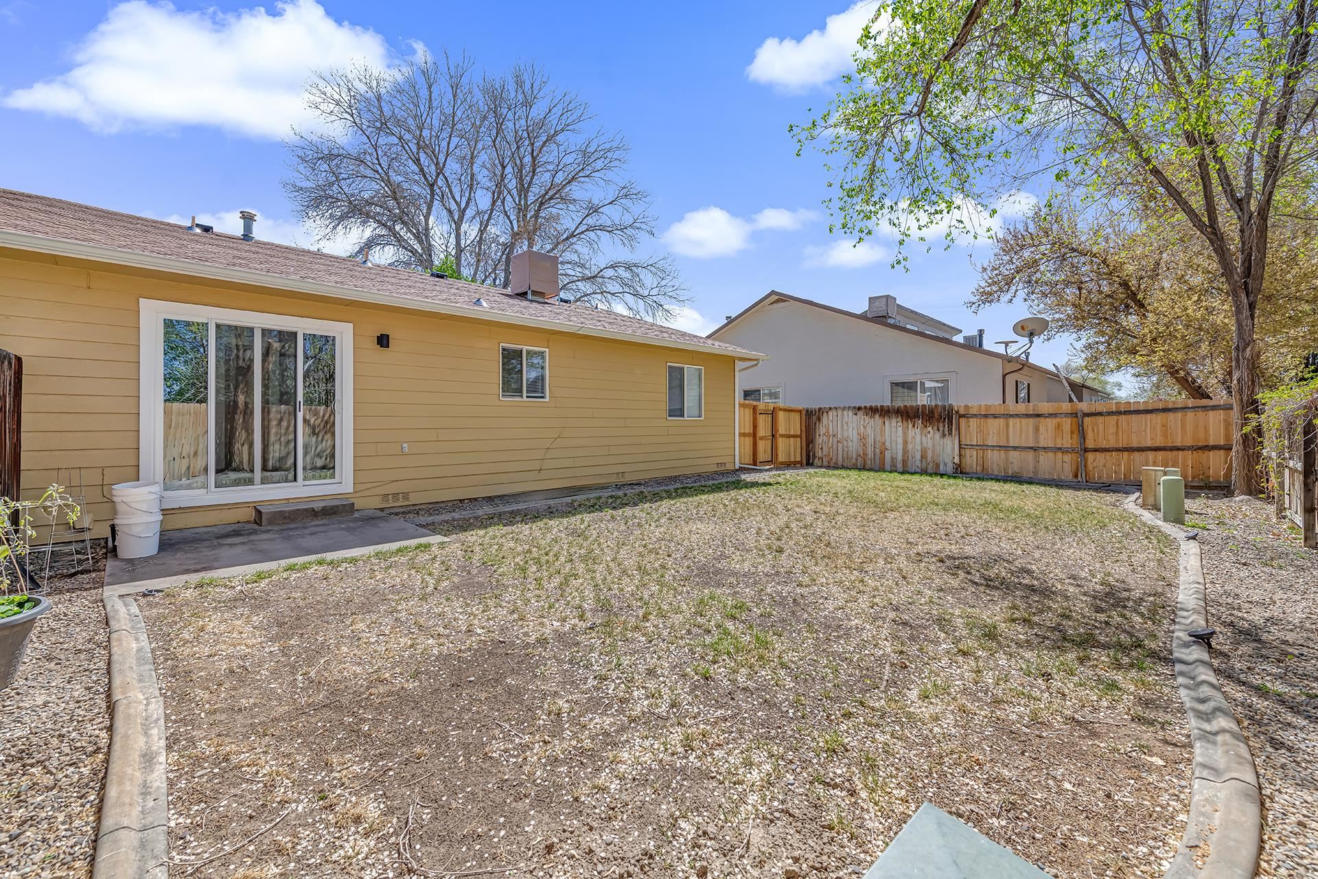 419 1/2 29 1/2 Road Grand Junction, CO 81504 - Photo 32 of 36 a view of a house with a yard and large tree