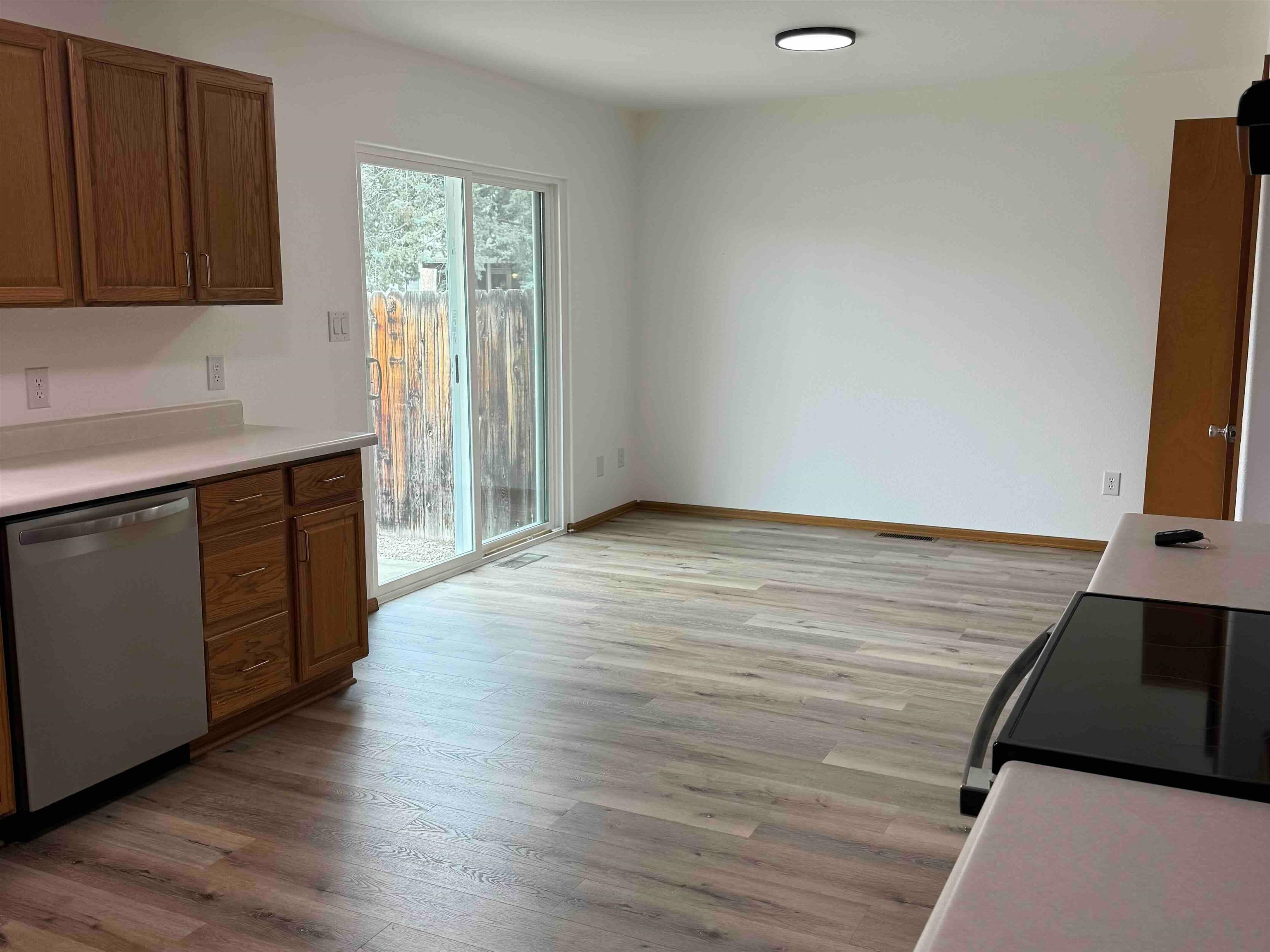 419 1/2 29 1/2 Road Grand Junction, CO 81504 - Photo 4 of 36 an empty room with wooden floor and cabinet
