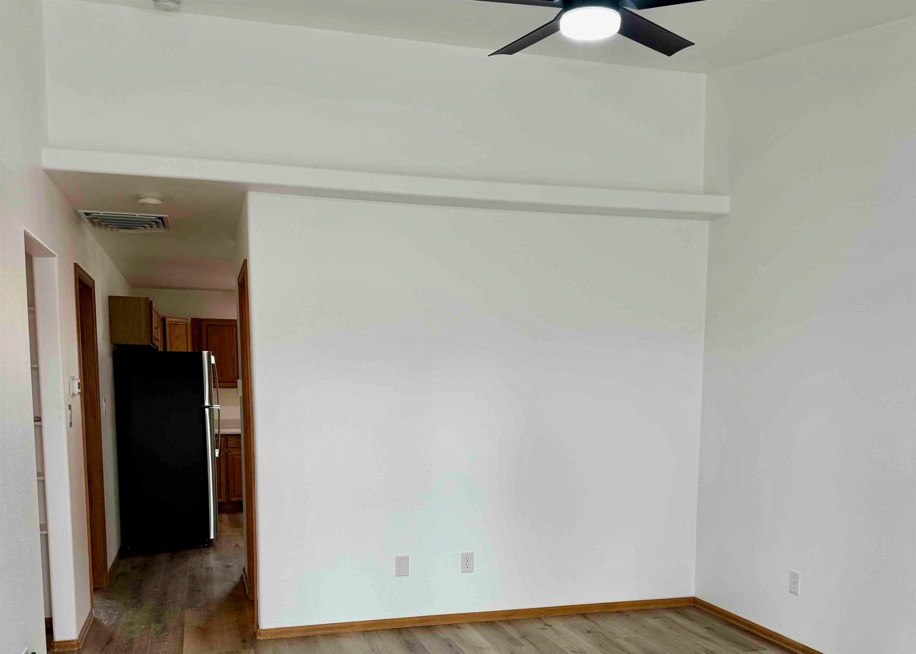 419 1/2 29 1/2 Road Grand Junction, CO 81504 - Photo 7 of 36 a view of an empty room with wooden floor and closet