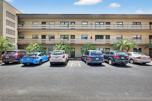 a view of a hallway with a refrigerator