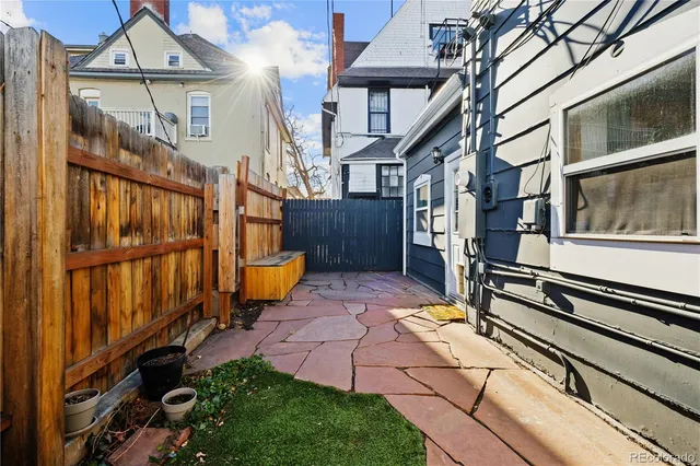 an aerial view of houses with outdoor space