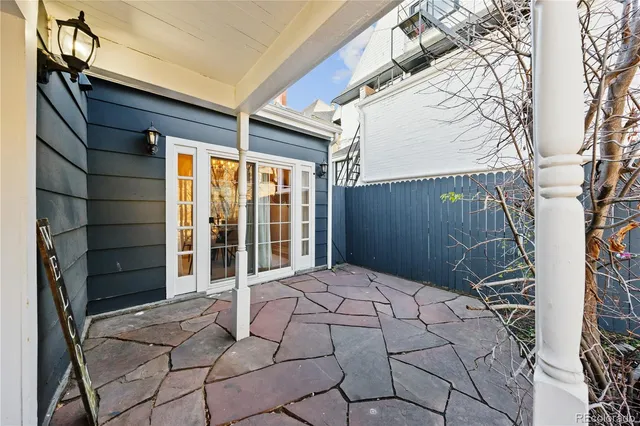 a living room with furniture potted plant and a fireplace