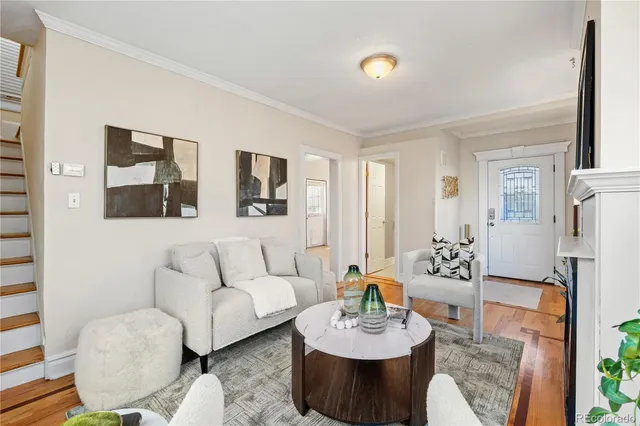 a living room with furniture fireplace and window