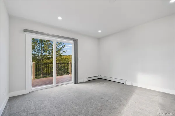 an empty room with a bathroom