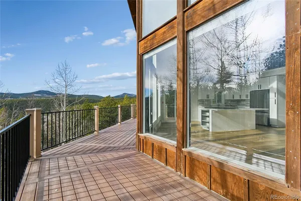 a big house with palm trees in front of it