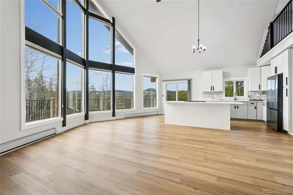 a view of a kitchen with a stove cabinets and wooden floor
