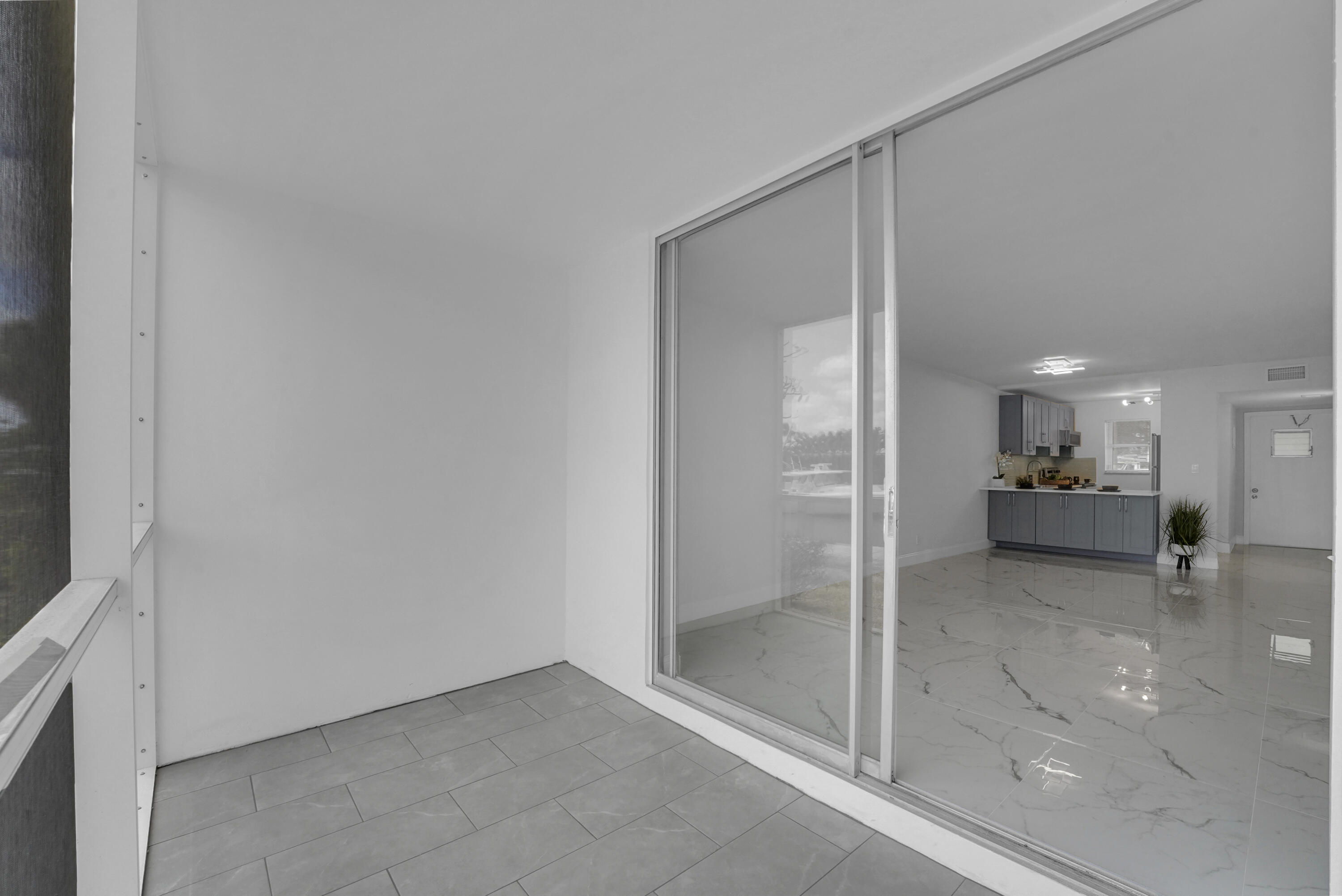 750 Northeast Spanish River Boulevard, Unit 1020 Boca Raton, FL 33431 - Photo 12 of 43 a bathroom with a glass shower door and a sink