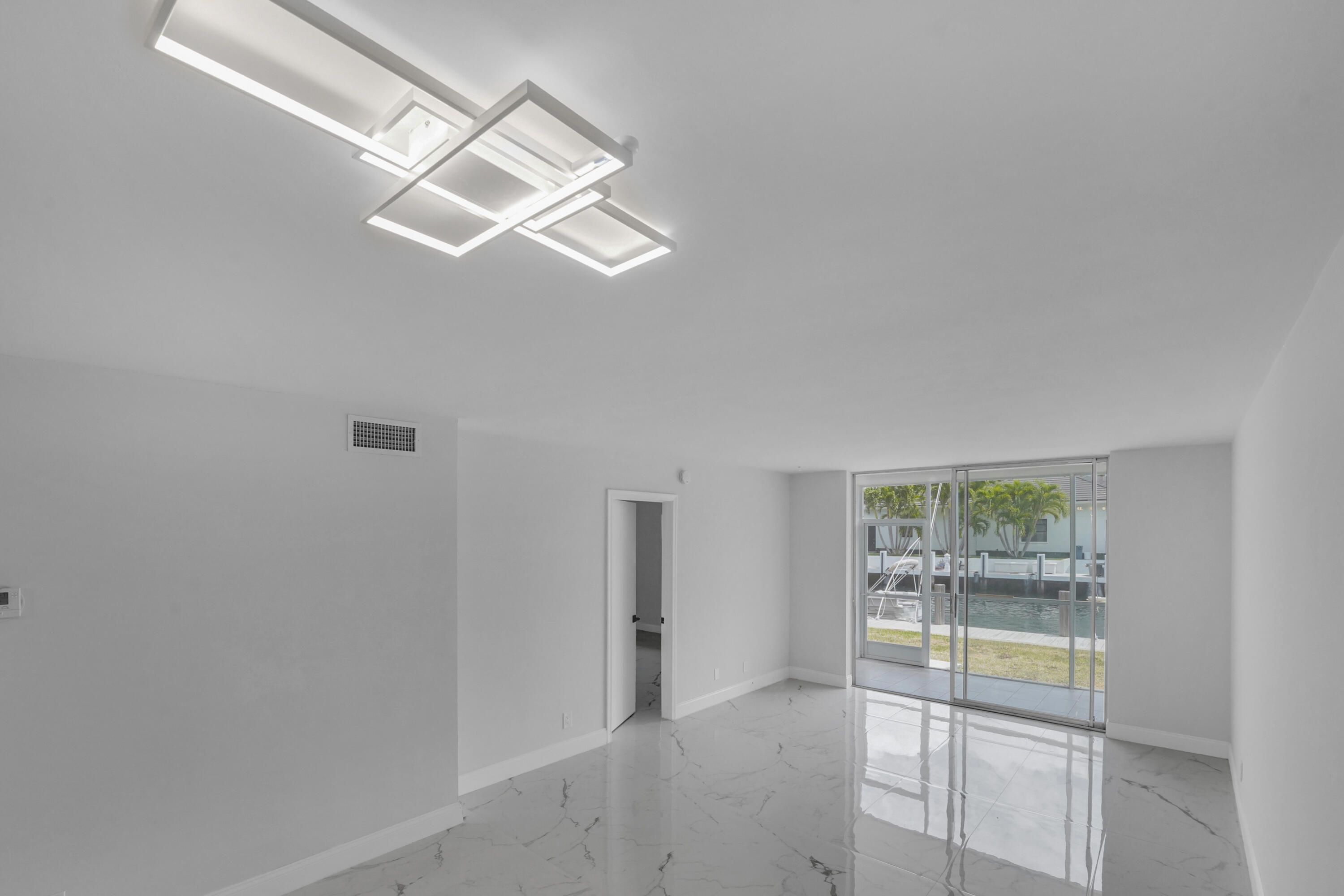 750 Northeast Spanish River Boulevard, Unit 1020 Boca Raton, FL 33431 - Photo 16 of 43 an empty room with windows and closet