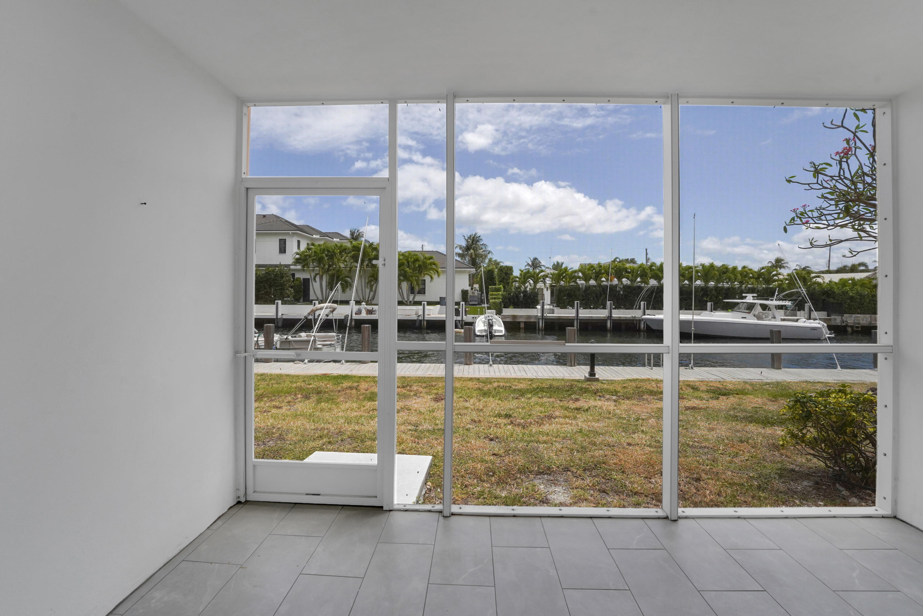 750 Northeast Spanish River Boulevard, Unit 1020 Boca Raton, FL 33431 - Photo 4 of 43 a view of a swimming pool with a lounge chair