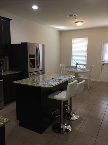 a kitchen with a sink appliances and cabinets
