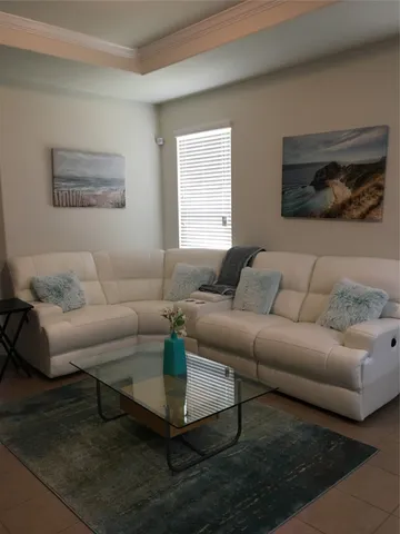a living room with furniture and a window