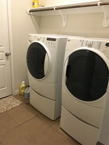 a utility room with dryer and washer